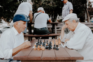 older adults playing chess